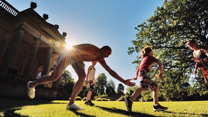 Family playing near Gibside Chapel in the summer sun
